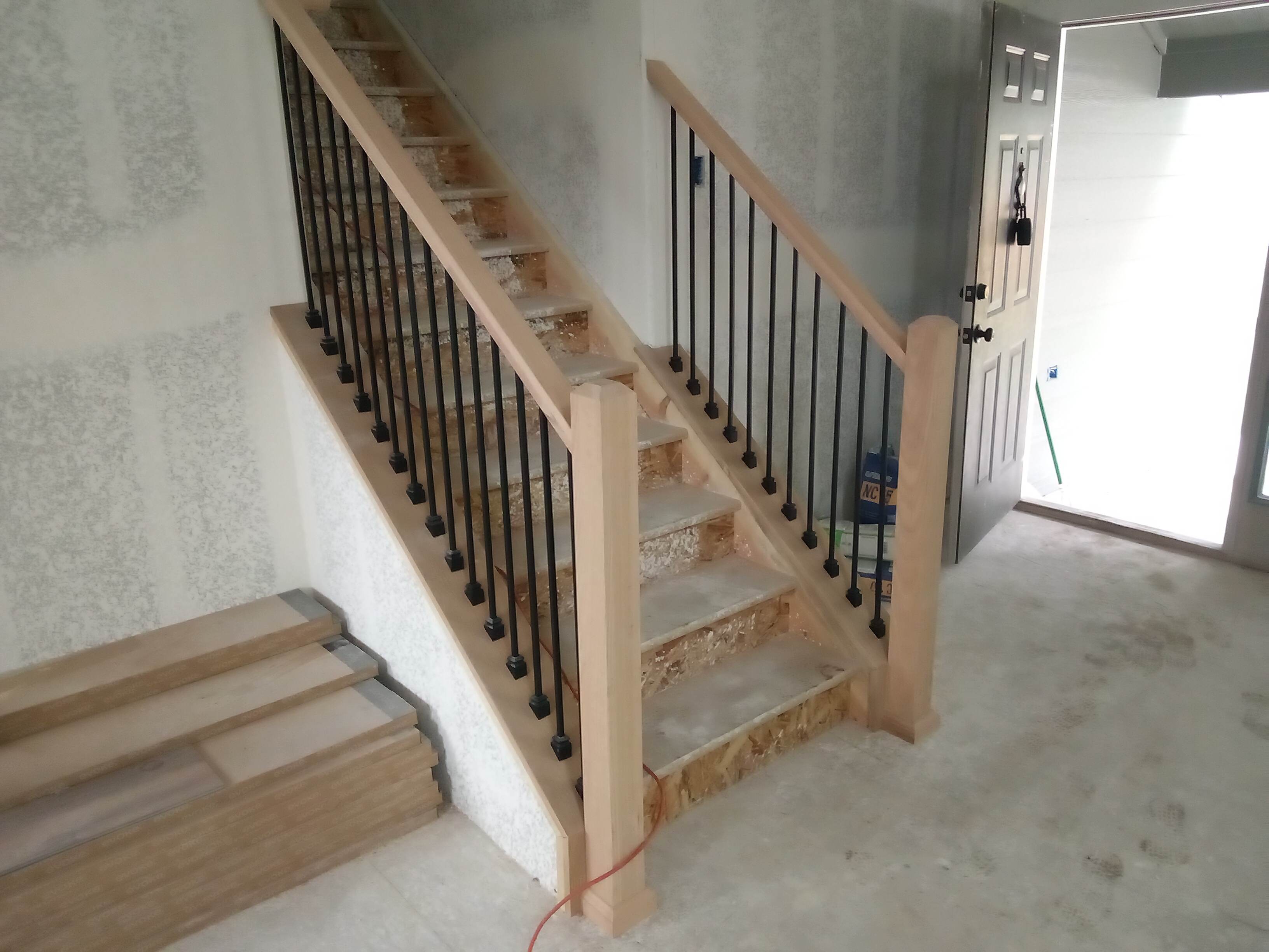 Custom Kitchen cabinet and stair railing installation in Denver, CO.