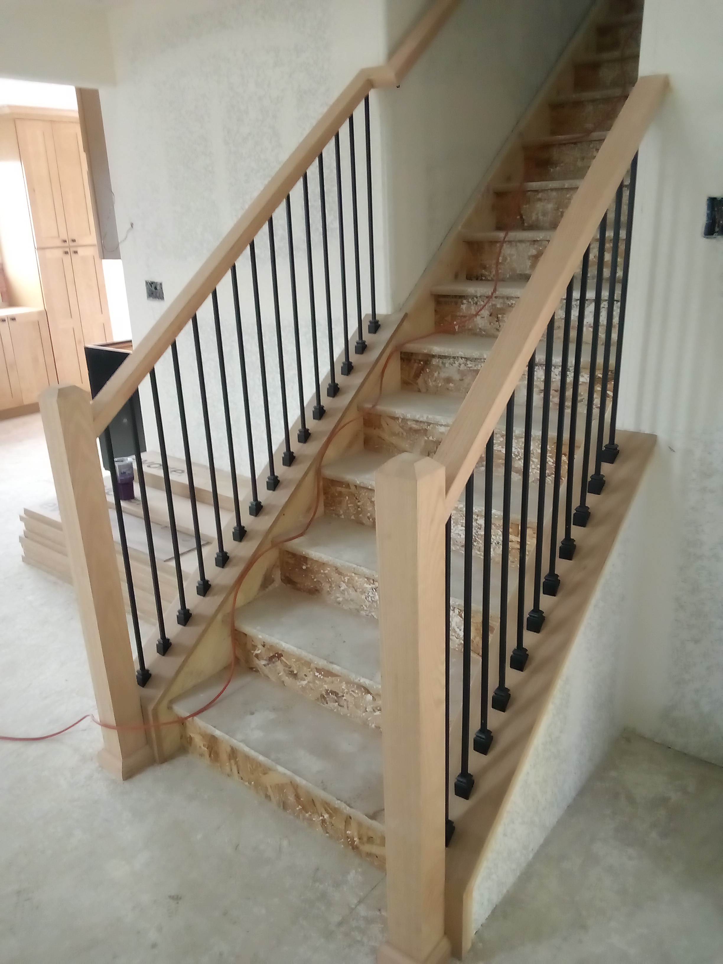 Custom Kitchen cabinet and stair railing installation in Denver, CO.